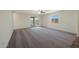 A neutral bedroom with a large glass sliding door to the backyard and a window bringing in ample light at 551 S West Virginia Ave, Florence, AZ 85132