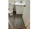 Bathroom featuring a toilet and a sink with modern vanity, and updated gray vinyl flooring at 6120 N 30Th Ave, Phoenix, AZ 85017