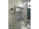 Open medicine cabinet in bathroom with chrome towel ring and modern lighting above vanity at 6120 N 30Th Ave, Phoenix, AZ 85017