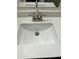 Bathroom sink with white quartz countertop and stainless steel faucet at 6120 N 30Th Ave, Phoenix, AZ 85017
