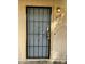 Exterior view of a secured front door with a lockbox and porch light at 6120 N 30Th Ave, Phoenix, AZ 85017
