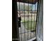 View of a front door with decorative security door and view of the neighborhood at 6120 N 30Th Ave, Phoenix, AZ 85017