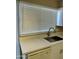 Kitchen sink near window with blinds and under-counter dishwasher at 6120 N 30Th Ave, Phoenix, AZ 85017