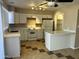 Renovated kitchen boasting new laminate flooring, countertops, and breakfast bar at 6120 N 30Th Ave, Phoenix, AZ 85017