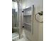 Open medicine cabinet in bathroom with chrome towel ring to the right and modern countertops below at 6120 N 30Th Ave, Phoenix, AZ 85017
