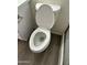 Bathroom featuring a modern toilet and a gray wood-look flooring at 6120 N 30Th Ave, Phoenix, AZ 85017