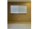 Tan room featuring a window with white blinds and visible outlets on the wall at 6120 N 30Th Ave, Phoenix, AZ 85017