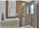 Bathroom featuring a modern vanity, sink, mirror, and glass enclosed shower with tile surround at 6184 E Dusty Coyote Cir, Scottsdale, AZ 85266