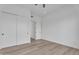 A vacant bedroom with hardwood floors and a double-door closet at 6184 E Dusty Coyote Cir, Scottsdale, AZ 85266