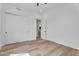 Vacant bedroom with hardwood floors, closet, and bathroom access at 6184 E Dusty Coyote Cir, Scottsdale, AZ 85266