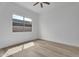 Vacant bedroom with hardwood floors and an energy efficient window at 6184 E Dusty Coyote Cir, Scottsdale, AZ 85266