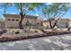 Beautiful home showcasing desert landscaping and mature trees in the front yard at 6184 E Dusty Coyote Cir, Scottsdale, AZ 85266