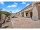 Spacious covered patio with flagstone flooring and desert views at 6184 E Dusty Coyote Cir, Scottsdale, AZ 85266