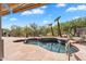 Inviting pool featuring desert landscaping, an attached spa, and flagstone decking at 6184 E Dusty Coyote Cir, Scottsdale, AZ 85266