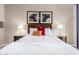 Comfortable bedroom featuring a wood bed, matching nightstands, and soft lighting at 6202 E Mckellips Rd # 183, Mesa, AZ 85215