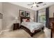Cozy bedroom with a wood bed frame, patterned bedding, and two bedside tables at 6202 E Mckellips Rd # 183, Mesa, AZ 85215