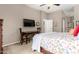 Bedroom featuring a wood bed frame, TV, desk and large closet at 6202 E Mckellips Rd # 183, Mesa, AZ 85215