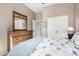 Neutral bedroom offering a dresser, closet, and a comfy bed with stylish bedding at 6202 E Mckellips Rd # 183, Mesa, AZ 85215