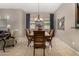 Elegant dining room with a wood table, upholstered chairs, and natural light at 6202 E Mckellips Rd # 183, Mesa, AZ 85215