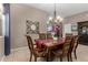 Open dining area featuring a wood table, decorative accents, and neutral paint at 6202 E Mckellips Rd # 183, Mesa, AZ 85215