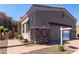 Two car garage with brick trim and paved brick driveway at 6202 E Mckellips Rd # 183, Mesa, AZ 85215