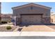 Two car garage with brick trim and paved brick driveway at 6202 E Mckellips Rd # 183, Mesa, AZ 85215