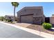 Two car garage with brick trim and paved brick driveway at 6202 E Mckellips Rd # 183, Mesa, AZ 85215
