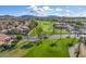 Scenic aerial shot of a lush golf course set against a backdrop of desert landscape and distant mountains at 6202 E Mckellips Rd # 183, Mesa, AZ 85215