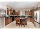 Spacious kitchen with dark cabinetry, granite countertops, and stainless steel appliances at 6202 E Mckellips Rd # 183, Mesa, AZ 85215