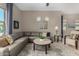 Inviting living room featuring a large sectional sofa, round coffee table, and neutral decor at 6202 E Mckellips Rd # 183, Mesa, AZ 85215