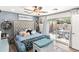 Bedroom with tufted headboard and access to private outdoor patio at 6219 N 22Nd Dr, Phoenix, AZ 85015