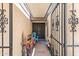 Inviting entryway with custom iron gate, vibrant decor, and a cozy seating area creating a welcoming ambiance at 6219 N 22Nd Dr, Phoenix, AZ 85015