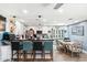 Bright kitchen with white cabinets, granite countertops, and a breakfast bar with seating, perfect for casual dining at 6219 N 22Nd Dr, Phoenix, AZ 85015