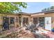 Spacious patio area with multiple seating areas, sliding glass doors, and an outdoor grill at 6219 N 22Nd Dr, Phoenix, AZ 85015