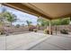 Large covered patio overlooking a well manicured backyard and block wall at 637 E Settlers Trl, Casa Grande, AZ 85122