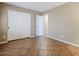 Bedroom featuring tile floors and a closet with white sliding doors at 637 E Settlers Trl, Casa Grande, AZ 85122