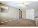 Spacious bedroom showcasing carpet flooring, natural light, and a closet at 637 E Settlers Trl, Casa Grande, AZ 85122