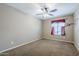 Cozy bedroom featuring carpet and a window with decorative valance at 637 E Settlers Trl, Casa Grande, AZ 85122