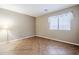 Bright bedroom featuring tile floors, neutral walls and a large window at 637 E Settlers Trl, Casa Grande, AZ 85122