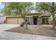 Charming single-story home featuring a three-car garage and stone accents around the front entrance at 637 E Settlers Trl, Casa Grande, AZ 85122