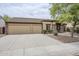 Spacious house with a three-car garage and large driveway offering ample parking space for residents and guests at 637 E Settlers Trl, Casa Grande, AZ 85122