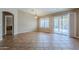 Living room with neutral paint, tile floor, and glass sliding door to patio area at 637 E Settlers Trl, Casa Grande, AZ 85122