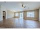 Spacious living room with tile flooring, ceiling fan, and access to the backyard at 637 E Settlers Trl, Casa Grande, AZ 85122