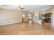 Open living space with neutral colors and tile flooring leading to the kitchen at 637 E Settlers Trl, Casa Grande, AZ 85122