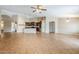 Open floor plan with tile flooring connecting the kitchen and living area at 637 E Settlers Trl, Casa Grande, AZ 85122