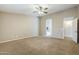 Spacious carpeted primary bedroom leading to ensuite bath and walk-in closet at 637 E Settlers Trl, Casa Grande, AZ 85122