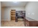 Office area with built in shelving and an abundance of storage options at 637 E Settlers Trl, Casa Grande, AZ 85122