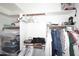 Organized closet with ample storage space and shelving for clothes and accessories at 6939 E Bramble Berry Ln, Scottsdale, AZ 85266