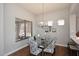 Elegant dining area featuring a chandelier and comfortable seating at 6939 E Bramble Berry Ln, Scottsdale, AZ 85266