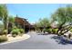 Desert home entrance with porte cochere, desert landscaping, and mountain views at 6939 E Bramble Berry Ln, Scottsdale, AZ 85266